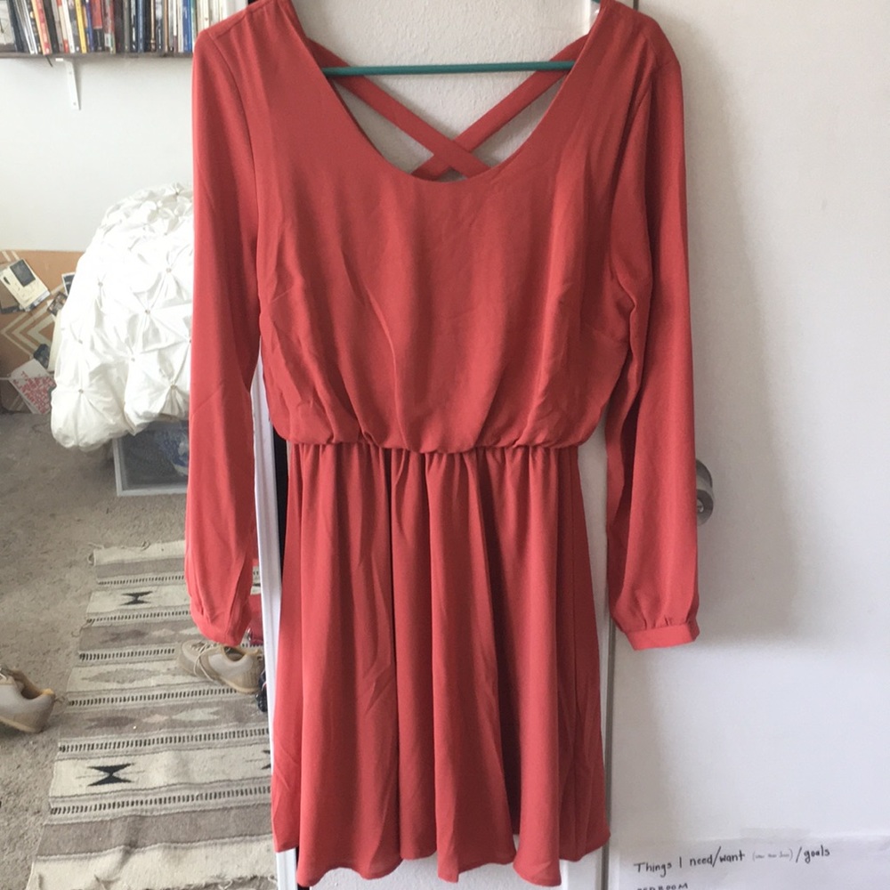 Knee length coral dress.